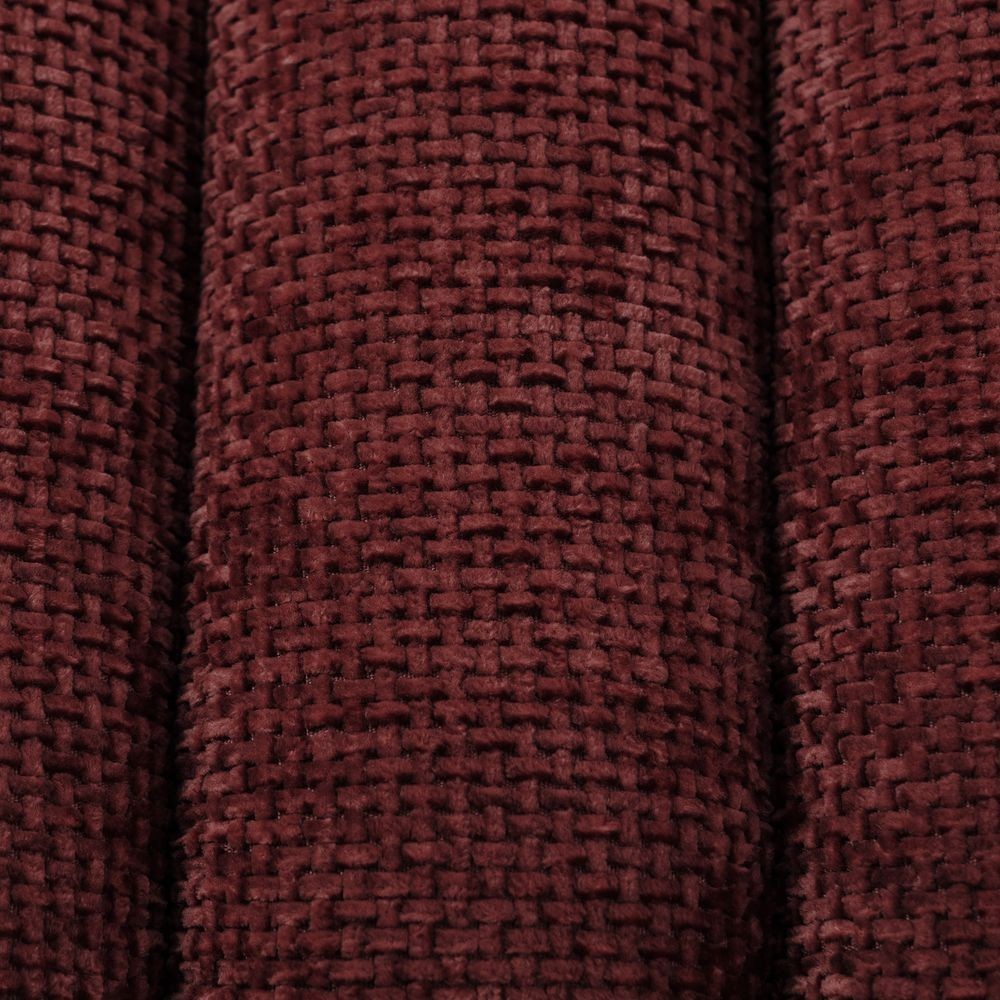 Gros plan sur la texture en tissu chenillé bordeaux du pouf ZAGO STORE avec son tissage en relief